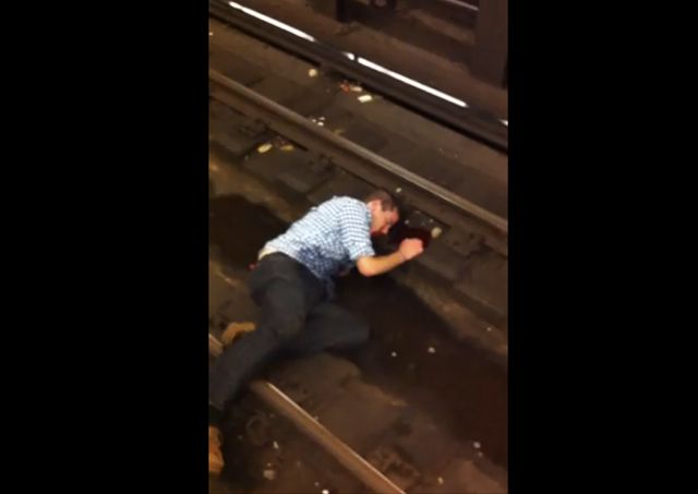 If you saw a drunken, bloodied man in distress lying on the tracks, would you stand there filming him while making light of the situation with your friends? These people didâthey took several videos while waiting for MTA to arrive. Most of those videos have been taken down, per the videographers requests, but you can watch one here.